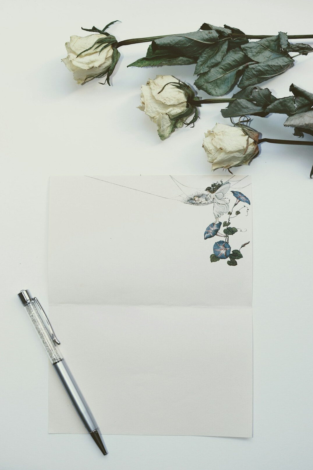 Documents and a pen on a desk