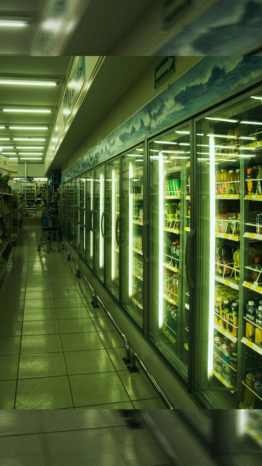 supermarket aisle with shoppers