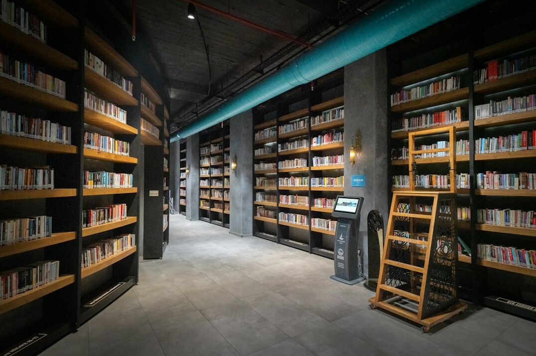 Quiet library with tall wooden shelves